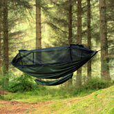DD Gear Sling attached to a hammock in a forest, designed for keeping camping gear off the ground.
